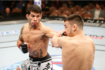 R. Assunção (left) attacks P. Munhoz (right) at UFC 170. Photo: Josh Hedges/UFC