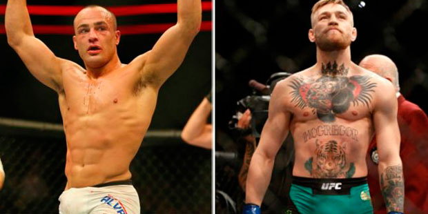 Alvarez (esq.) defende o cinturão dos leves contra McGregor (dir.) no UFC 205 em NY
